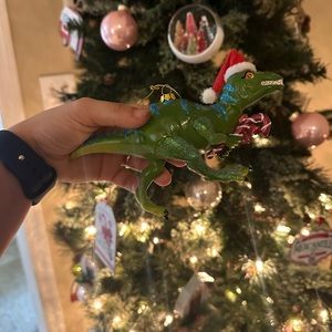 Three Christmas dinosaur ornaments
